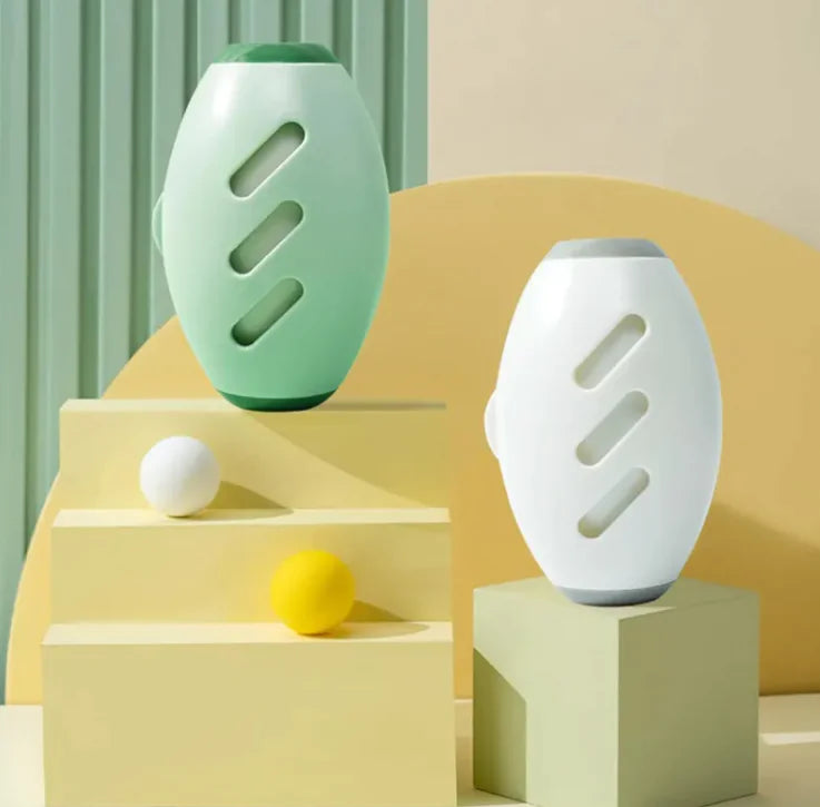 Two ceramic vases, one green and one white, on geometric blocks with a minimal background.